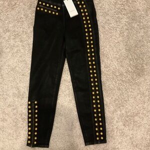 GUCCI WOMENS COATED DENIM PANT WITH STUDS.